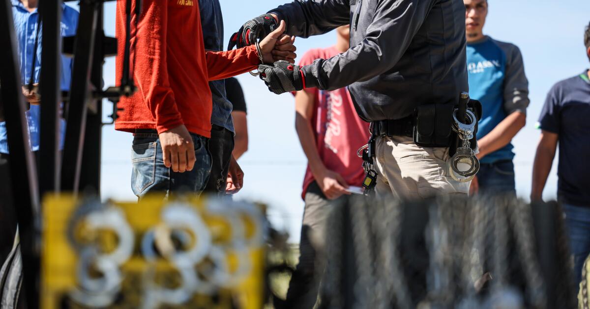 Campo, CA, Monday, June 3, 2024 - Men seeking asylum are detained by border patrol after crossing the US/Mexico border hours earlier. (Robert Gauthier/Los Angeles Times)
