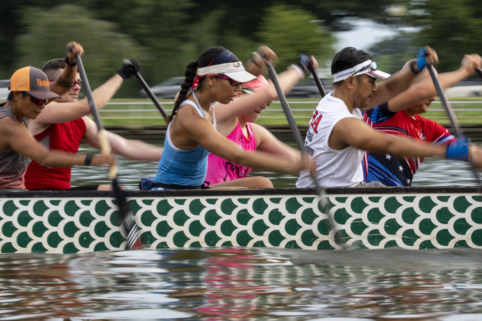 Kelly, center, and the DC Dragon Boat Club practice in the Washington Channel.