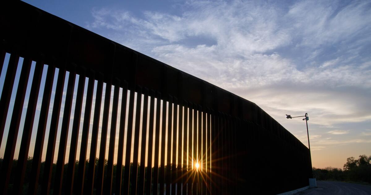 FILE - The sun sets over a section of the border wall, June 18, 2025, in Mission, Texas. (AP Photo/Jacquelyn Martin, File)