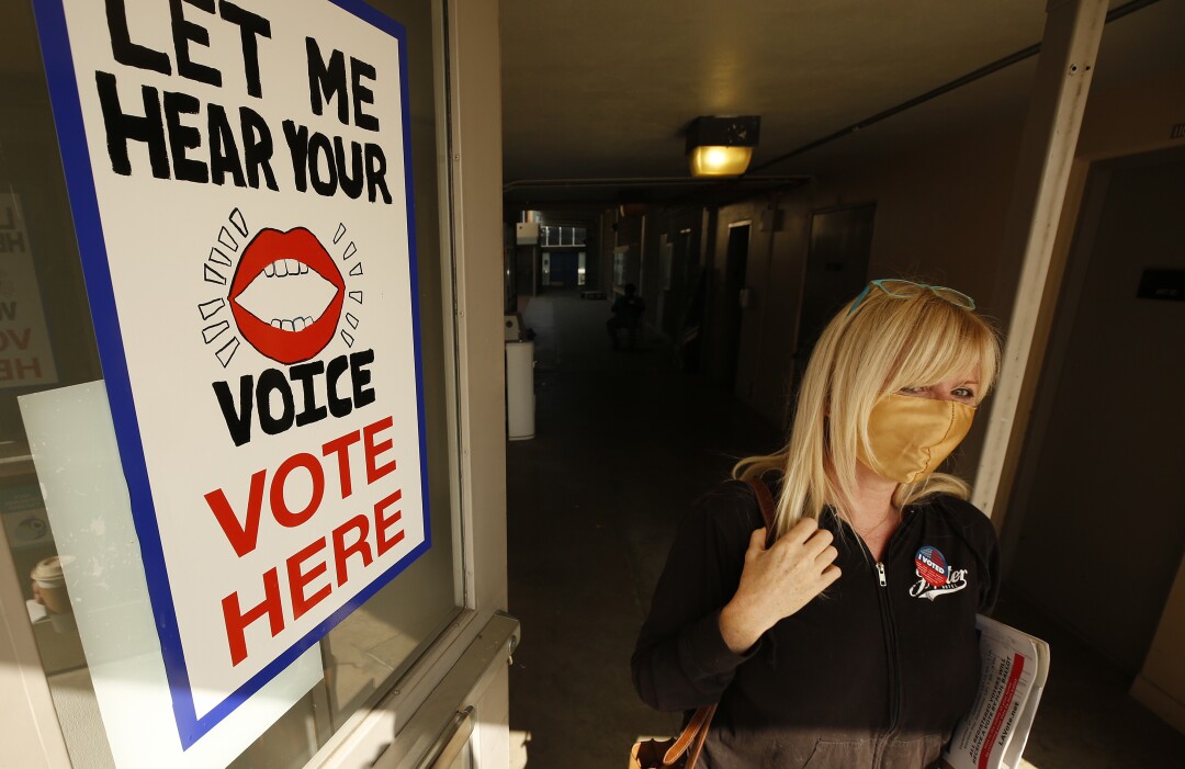 Mary Buckley departs the vote center at Santa Monica College after casting her ballot.