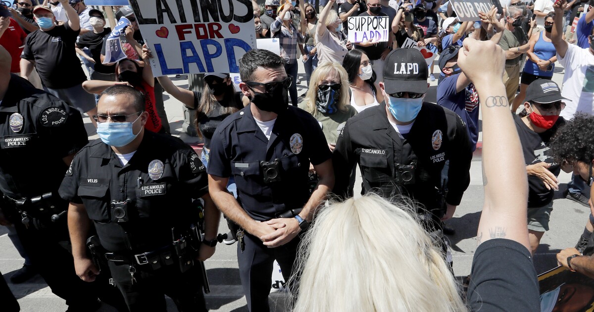 Amid a national movement to defund the police, LAPD officers rally outside downtown headquarters