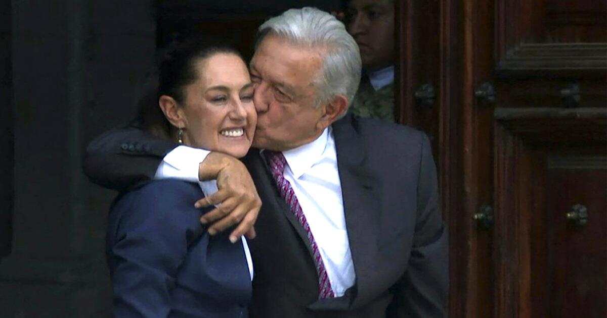 This frame grab from AFPTV video footage shows Mexican outgoing President Andres Manuel Lopez Obrador (R) welcoming Mexico's President-elect Claudia Sheinbaum before a meeting at the presidential palace in Mexico City on June 10, 2024. (Photo by Emma GUILLAUME / AFPTV / AFP)