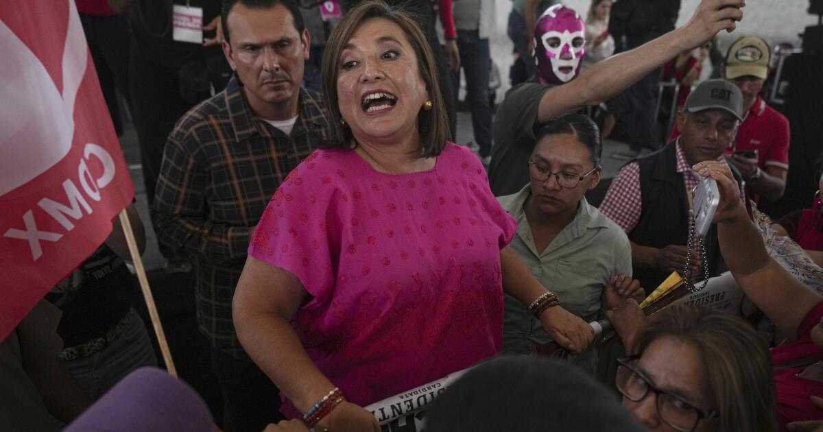 Presidential candidate Xóchitl Galvez greets supporters during a campaign rally in the Tepito neighborhood of Mexico City, Thursday, May 23, 2024. (AP Photo/Fernando Llano)