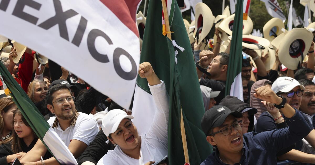 People cheer while listening to former Mayor Claudia Sheinbaum at a rally in Mexico City, Saturday, Aug. 26, 2023.