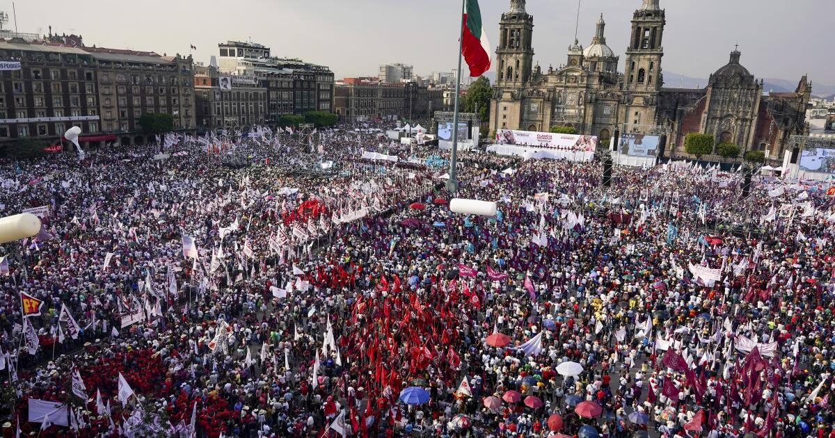 FILE - Supporters of presidential candidate Claudia Sheinbaum crowd into the Zocalo, facing the Cathedral, for her opening campaign rally in the Zocalo of Mexico City, March 1, 2024. (AP Photo/Aurea Del Rosario, File)