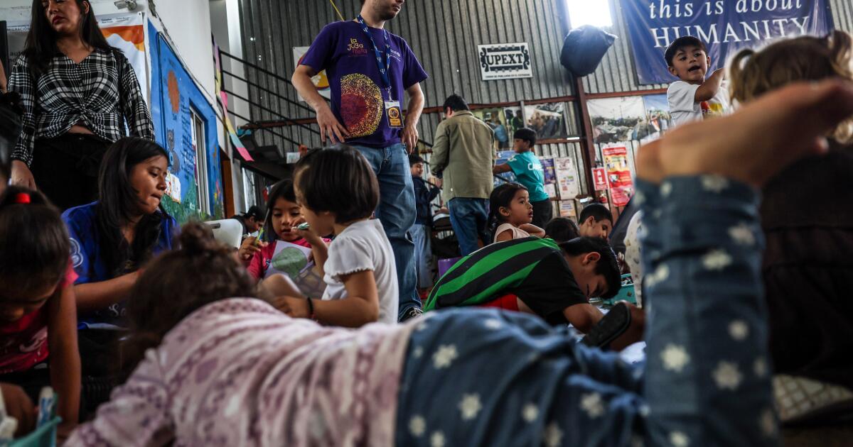 Tijuana, Mexico, Tuesday, June 4, 2024 - Children pass the time at Movimiento Juventud 2000, a migrant shelter, where dozens of families seeking asylum are living as they wait to meet with US officials. (Robert Gauthier/Los Angeles Times)