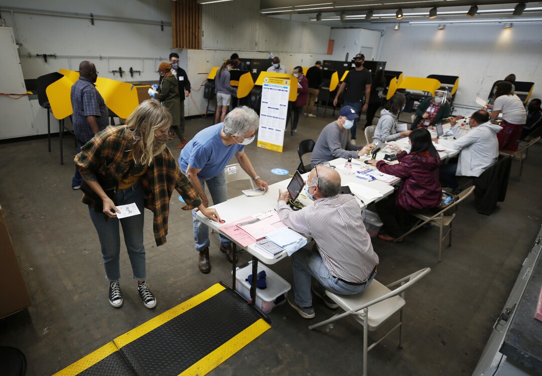Crowded with voters casting their ballots in a vote center at Santa Monica College as polls open Tuesday morning.