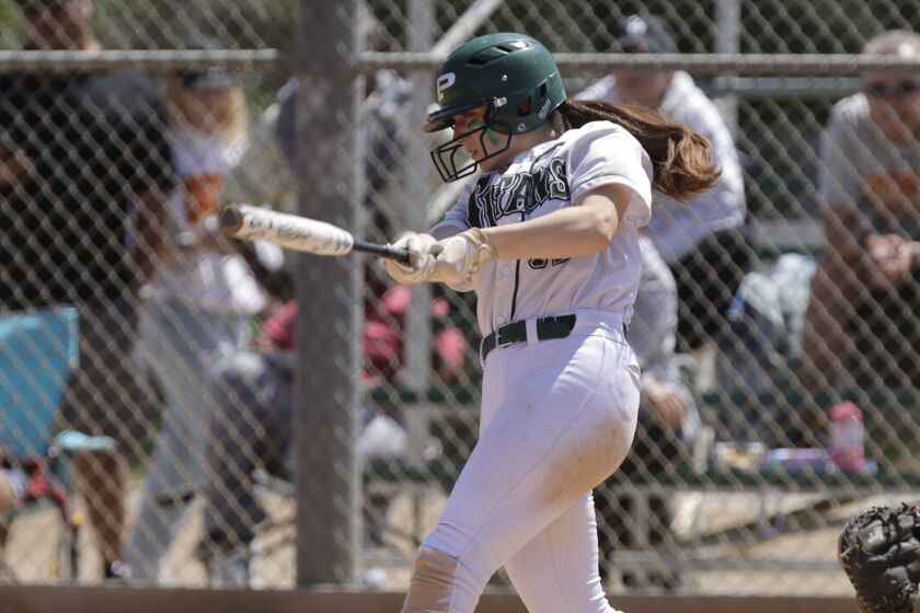 Poway's Alexis Huey hits an RBI single for go-ahead run in sixth inning of Titans' win over Cathedral Catholic on Saturday.
