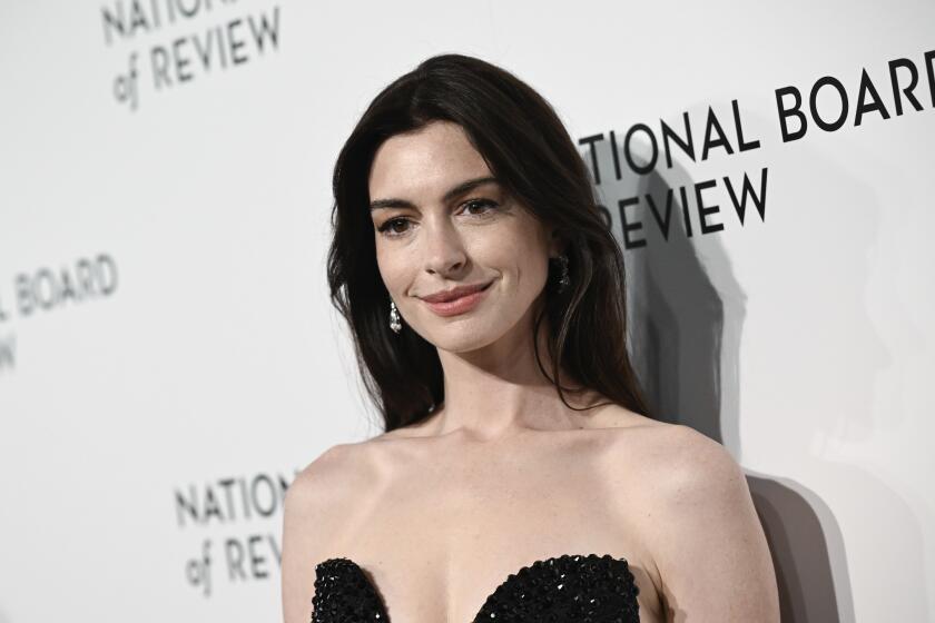 Anne Hathaway, in black sequin gown, at the National Board of Review Awards Gala on Jan. 11, 2024, in New York