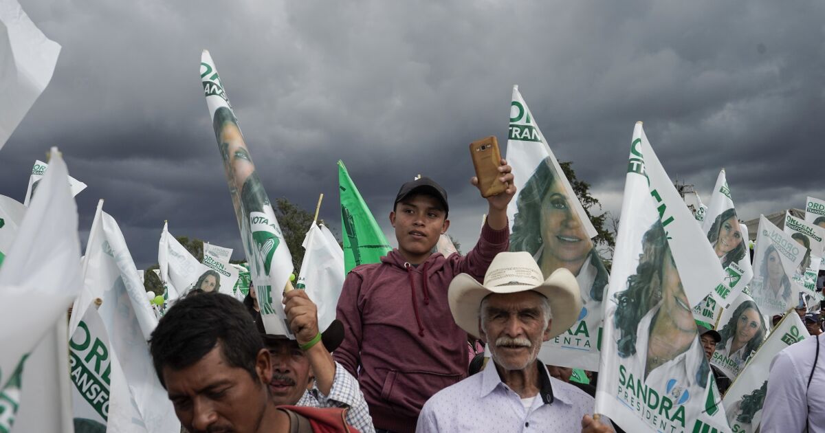 Supporters wait for Sandra Torres, presidential candidate of the UNE party, during a campaign rally in Chimaltenango, Guatemala, Sunday, Aug. 13, 2023. Torres will face Bernardo Arévalo of the Seed Movement party in an Aug. 20 runoff election. (AP Photo/Moises Castillo)