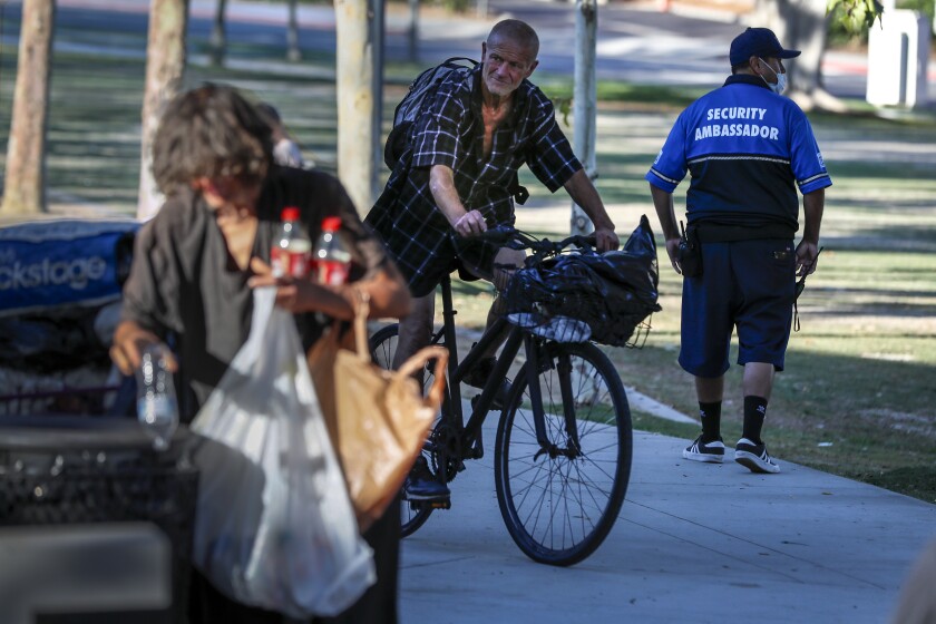 A Block by Block security ambassador patrols West Hollywood Park