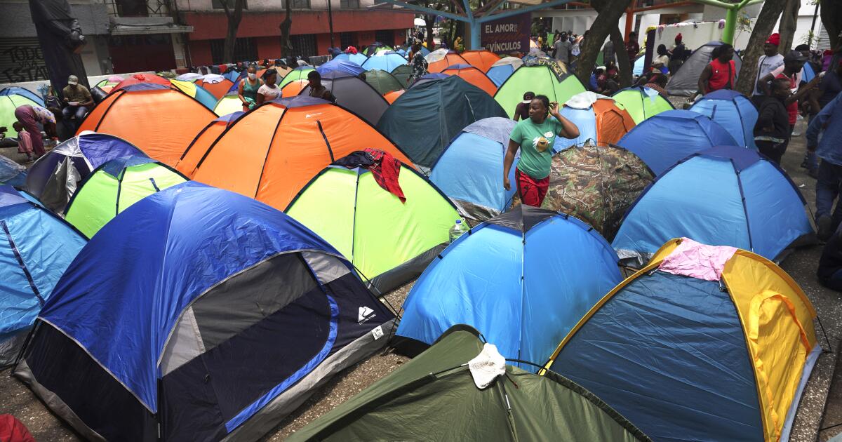 Haitian migrants camp out at the Giordano Bruno plaza in Mexico City, Thursday, May 18, 2023. The group was staying at a shelter in Mexico City on their way north but were forced to make camp at the park after the shelter closed. (AP Photo/Marco Ugarte)