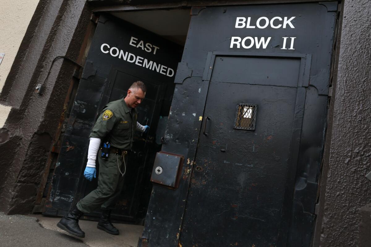Guard Andrei Akinshin mans the entrance to the East Block of San Quentin's death row. 