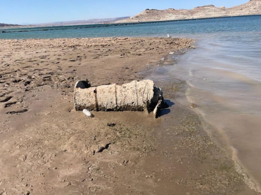 A muddy barrel on the dry bed of Lake Mead.