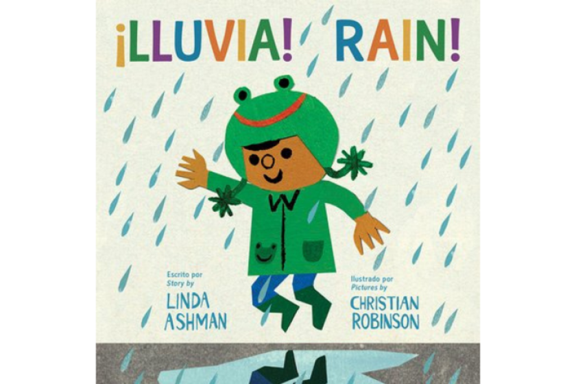 Lluvia! Rain! shows a young girl smilingin the rain, wearing a green raincoat with a frog hat. 