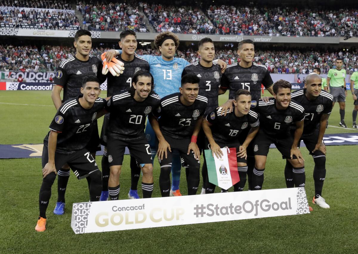 Mexico's soccer team poses on the field