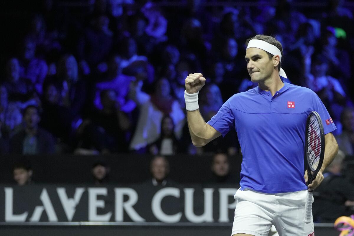 Roger Federer celebrates playing alongside Rafael Nadal in the final match of his career Friday.