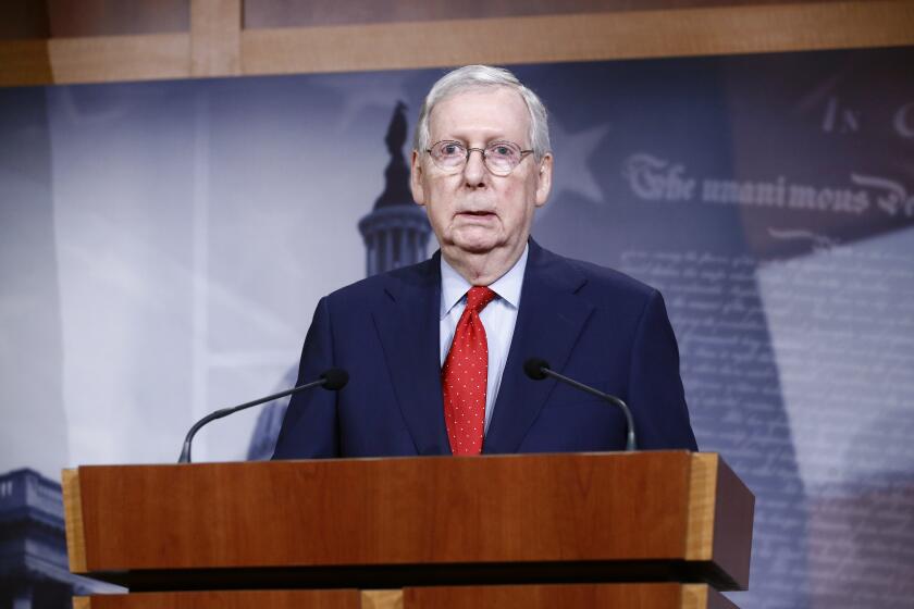 Senate Majority Leader Mitch McConnell of Ky., speaks with reporters after the Senate approved a nearly $500 billion coronavirus aid bill, Tuesday, April 21, 2020, on Capitol Hill in Washington. (AP Photo/Patrick Semansky)