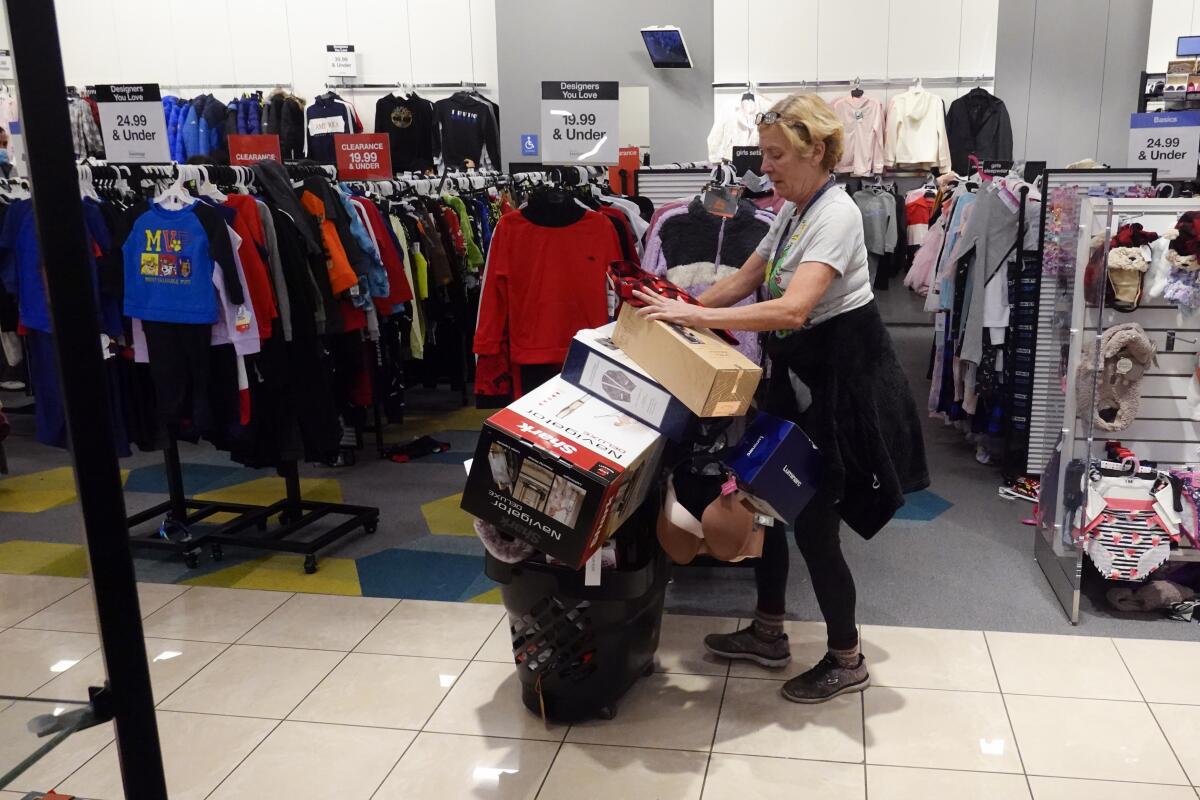 Shopper with overflowing cart