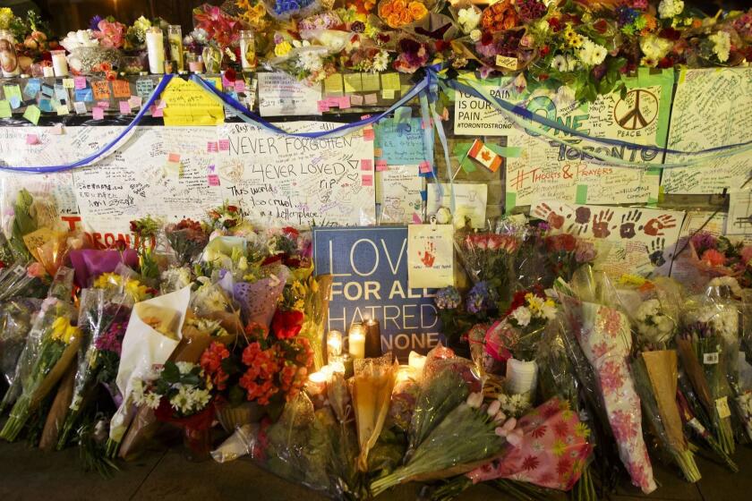 TORONTO, CANADA - APRIL 24: Flowers, cards, and words of sympathy adorn a makeshift memorial for victims of the mass killing on April 24, 2018 in Toronto, Canada. A suspect identified by police as Alek Minassian, 25, is in custody after a driver in a white rental van yesterday sped onto a crowded sidewalk, killing 10 and injuring at least 16. (Photo by Cole Burston/Getty Images) ** OUTS - ELSENT, FPG, CM - OUTS * NM, PH, VA if sourced by CT, LA or MoD **