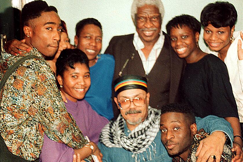 Tupac with family and friends, visiting the Shakur family patriarch, Salahdeen.
