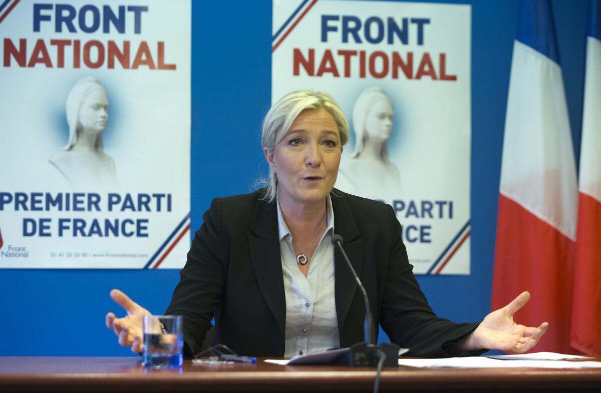 National Front leader Marine Le Pen speaks at party headquarters in Nanterre, west of Paris.