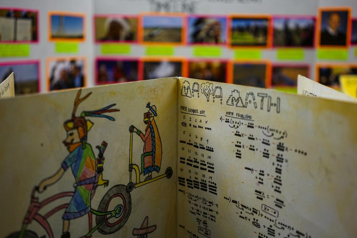 A presentation titled 'Maya Math' is displayed in a classroom at Camino Nuevo Charter Academy in Los Angeles. 