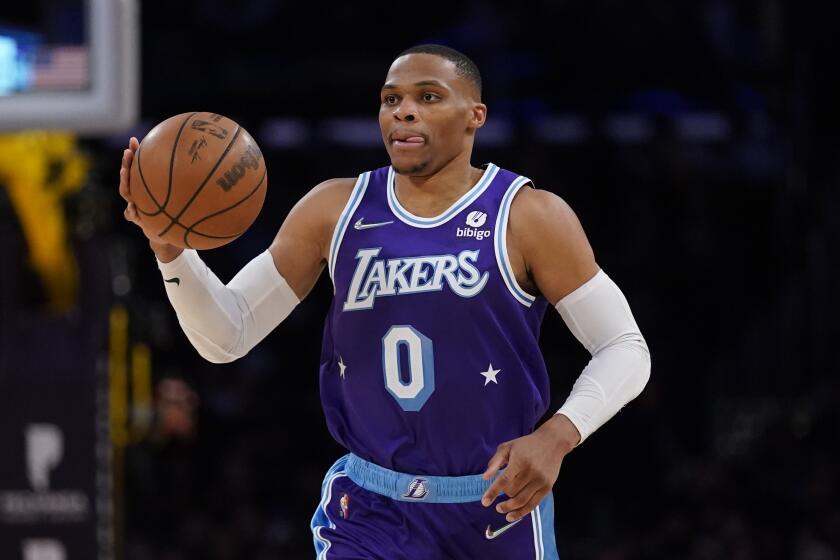 Los Angeles Lakers guard Russell Westbrook (0) controls the ball during an NBA basketball game.