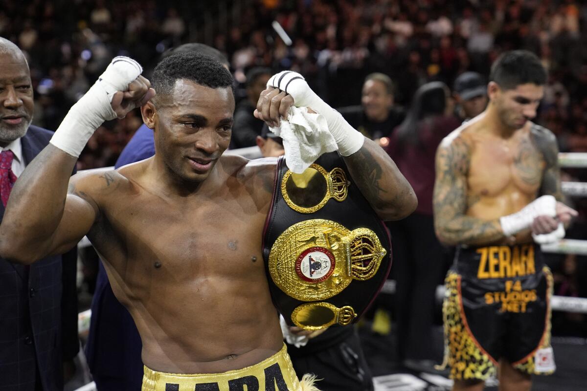 Erislandy Lara, of Cuba, celebrates after defeating  