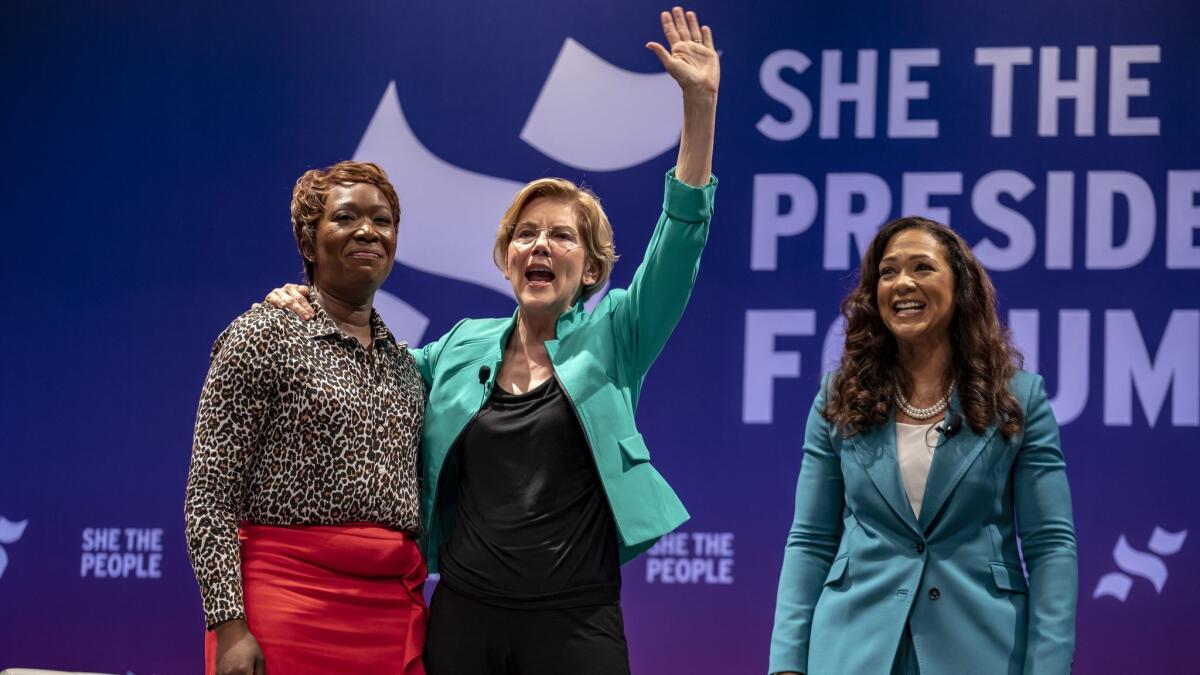 From left, MSNBC host Joy Reid, Democratic presidential candidate Sen. Elizabeth Warren and She the People founder Aimee Allison address a crowd Wednesday in Houston.