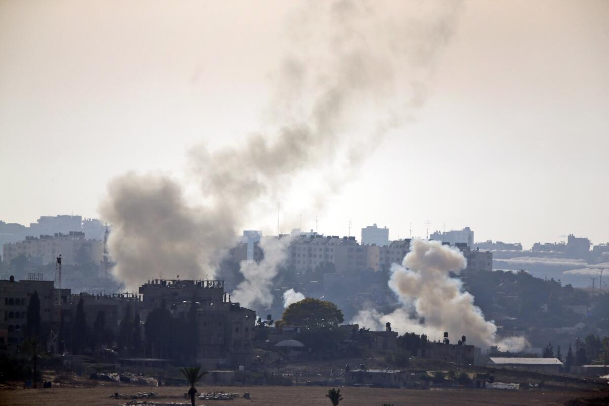 Smoke rises after Palestinian militants launched several rockets towards Israel on July 12.