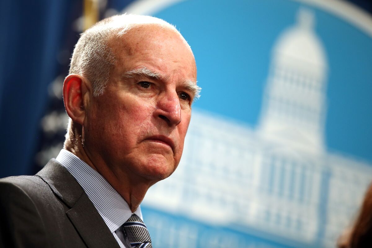 Then-Gov. Jerry Brown speaks at a news conference in Sacramento in 2015. 