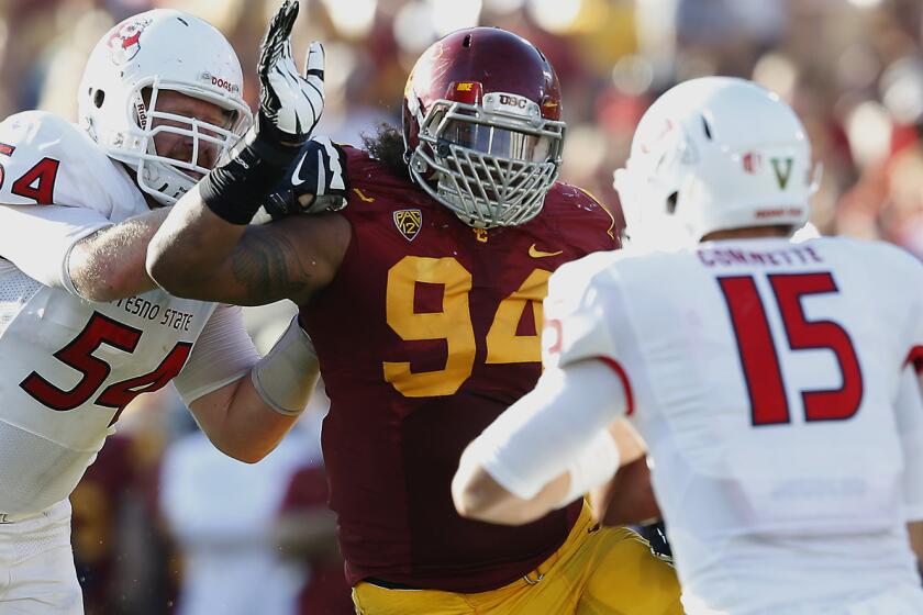 USC defensive end Leonard Williams pressures Fresno State quarterback Brandon Connette, right, during the Trojans' 52-13 win in August. Williams might be a good fit with the Oakland Raiders, who will have a high draft pick in the spring.