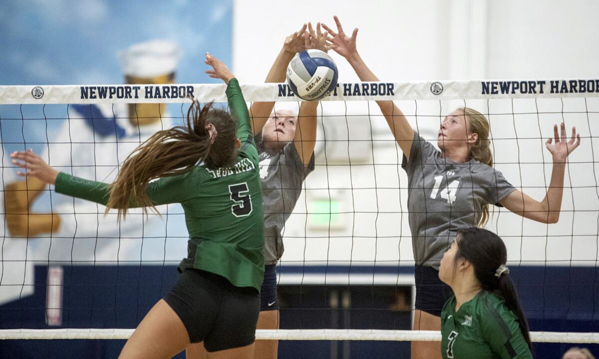 Newport Harbor's Gabbi Higgs, center, and Kayla Ihrig, right, attempt to block a shot by Sage Hill's Zoe Mazakas in a nonleague match at home on Tuesday.