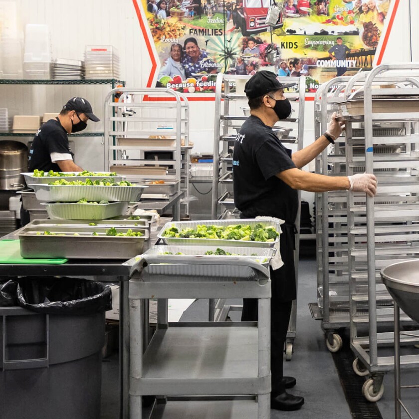 Trainees at Bracken's Kitchen prepare meals that partners in the region will later distribute.
