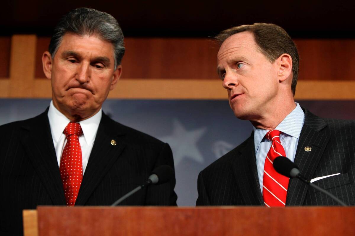 Sens. Joe Manchin III (D-W.Va.), left, and Patrick J. Toomey (R-Pa.) worked together to forge an accord on background checks.