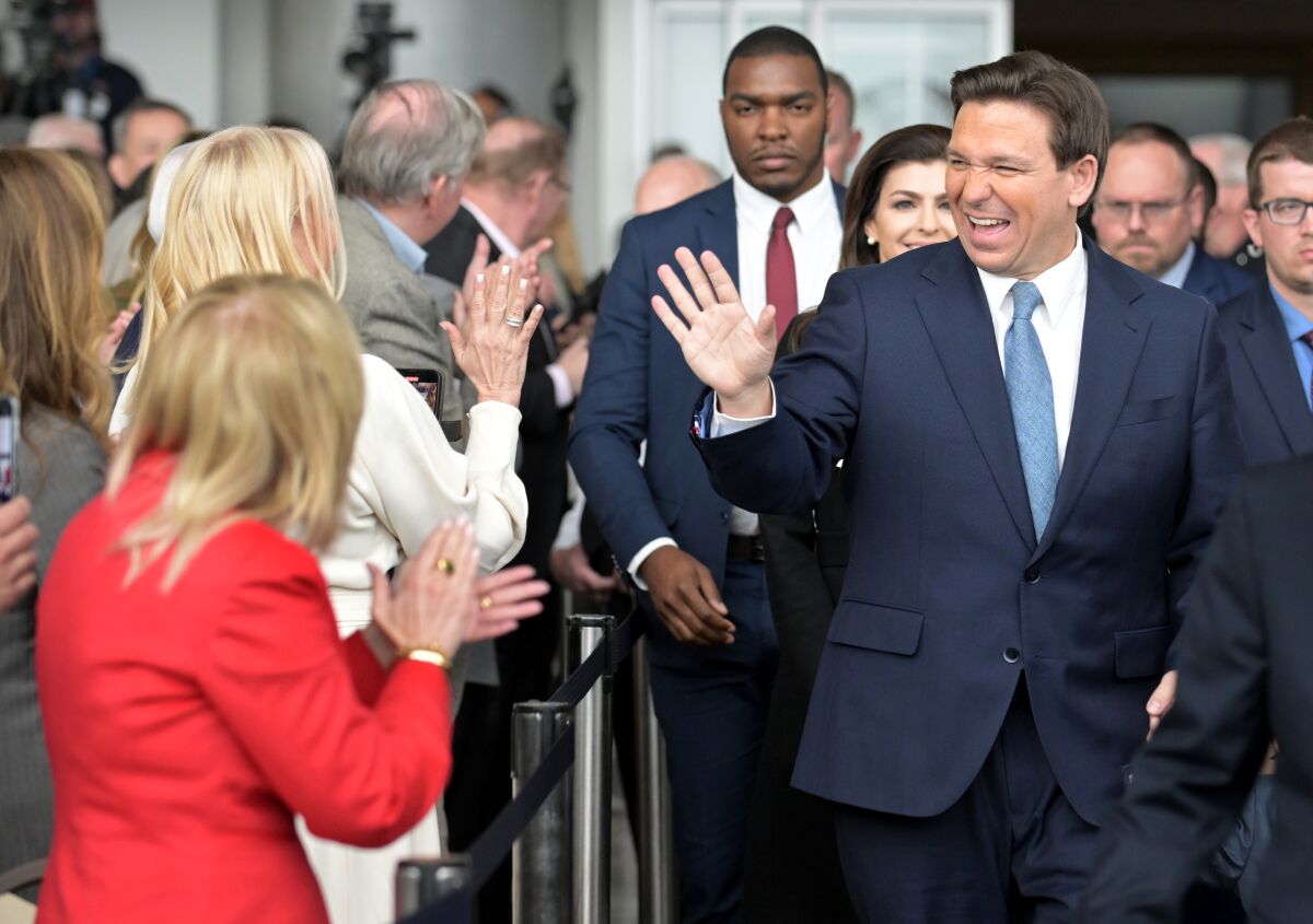 Florida Gov. Ron DeSantis greets people before speaking at the Ronald Reagan Library in Simi Valley on March 5.