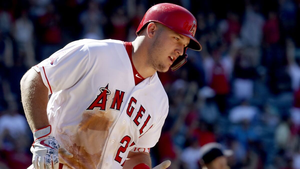 Angels center fielder Mike Trout rounds the bases after hitting a two-run home run against the Houston Astros in the seventh inning Sunday at Angel Stadium.