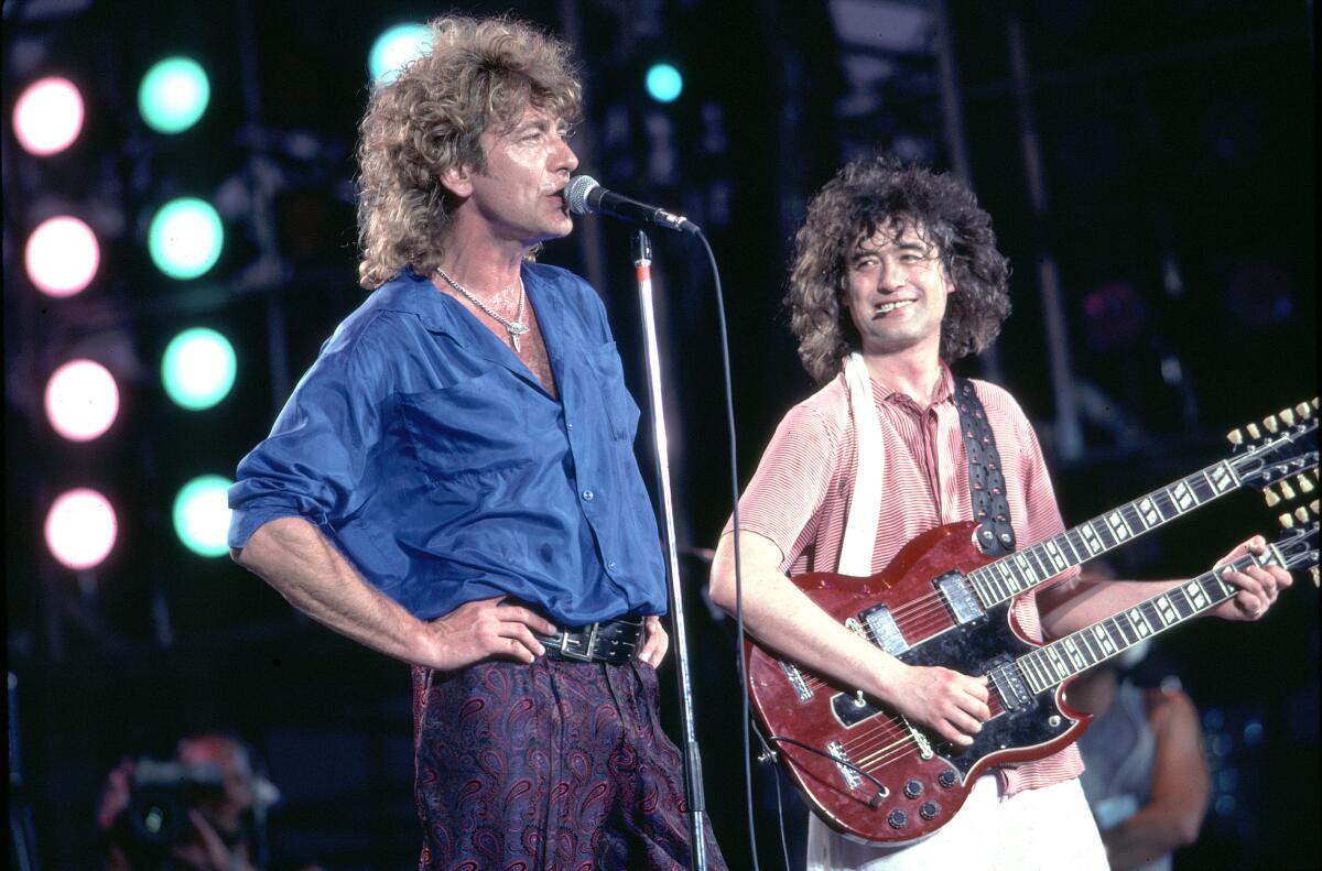 Robert Plant and Jimmy Page of Led Zeppelin are shown at the 1985 Live Aid benefit concert