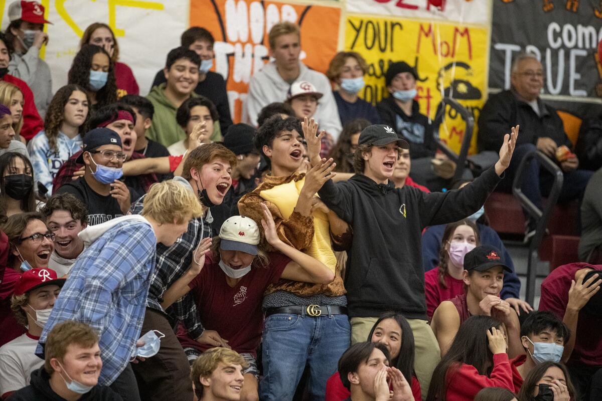 Estancia student supporters celebrate during the first Battle for the Bell rivalry game against Costa Mesa on Monday.