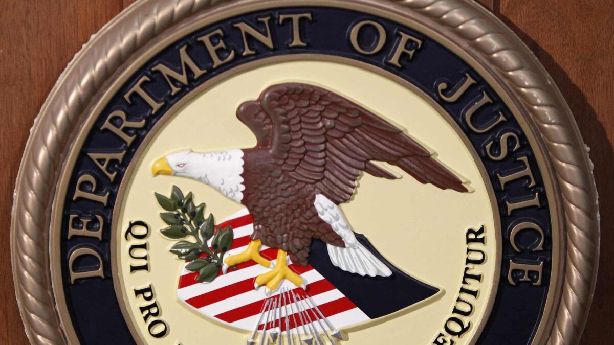 The Department of Justice logo REUTERS/Carlo Allegri (UNITED STATES - Tags: SCIENCE TECHNOLOGY BUSINESS TELECOMS CRIME LAW POLITICS)