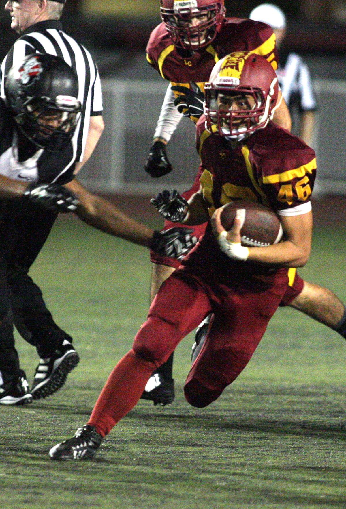 La Cañada's Ryan Breneman cuts for extra yards against Rio Hondo Prep in a non-league football game at La Cañada High School on Thursday, September 25, 2014.