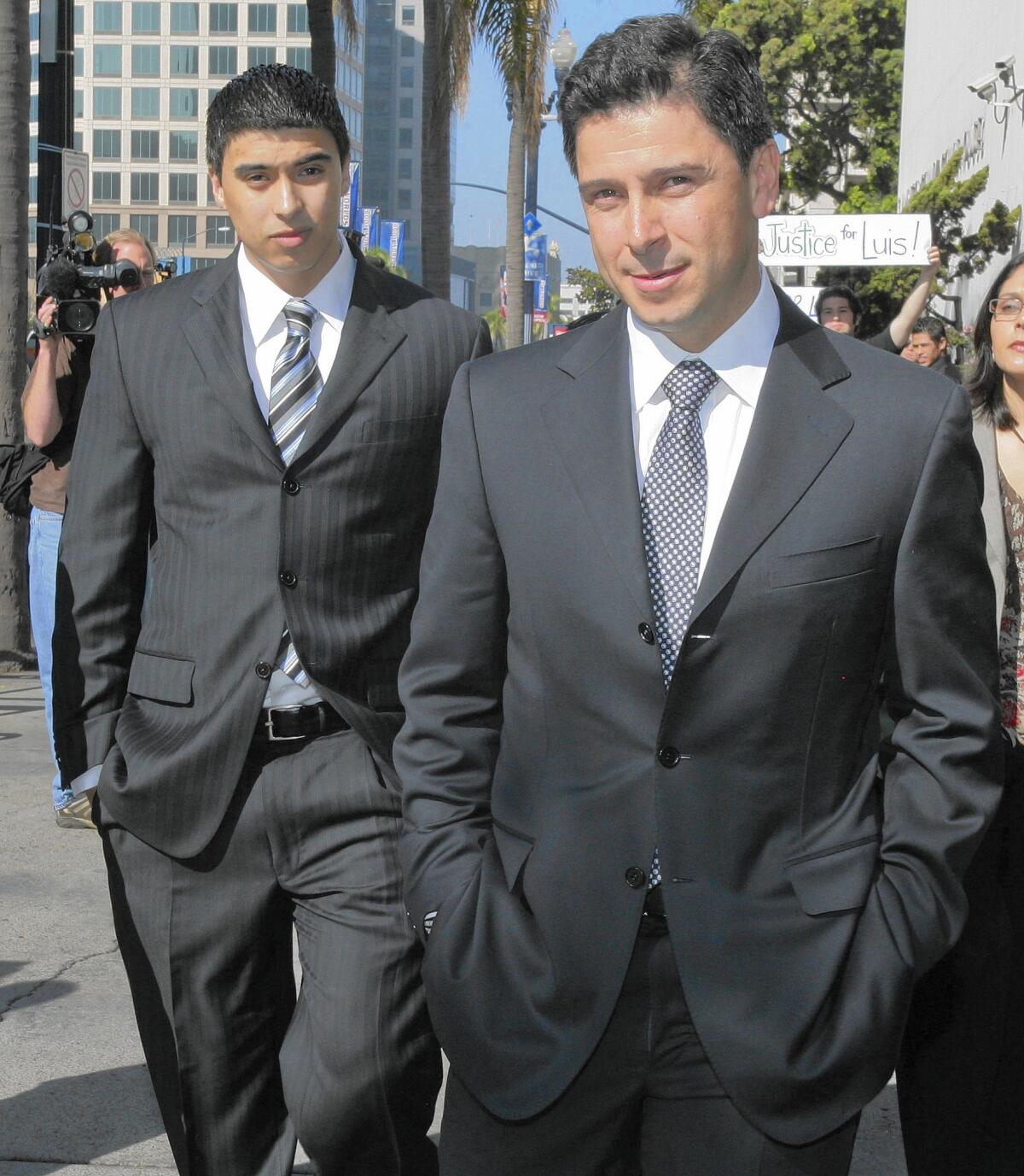 Former Assembly Speaker Fabian Nuñez, right, and his son Esteban leave a hearing in San Diego in 2009.