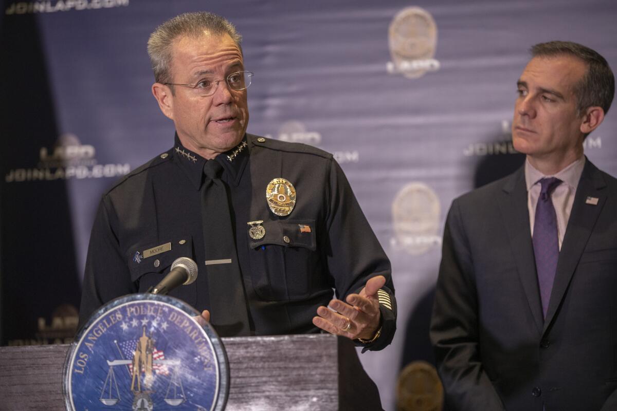 Mayor Eric Garcetti and LAPD Chief Michel Moore at a media briefing on crime statistics in January  2019.