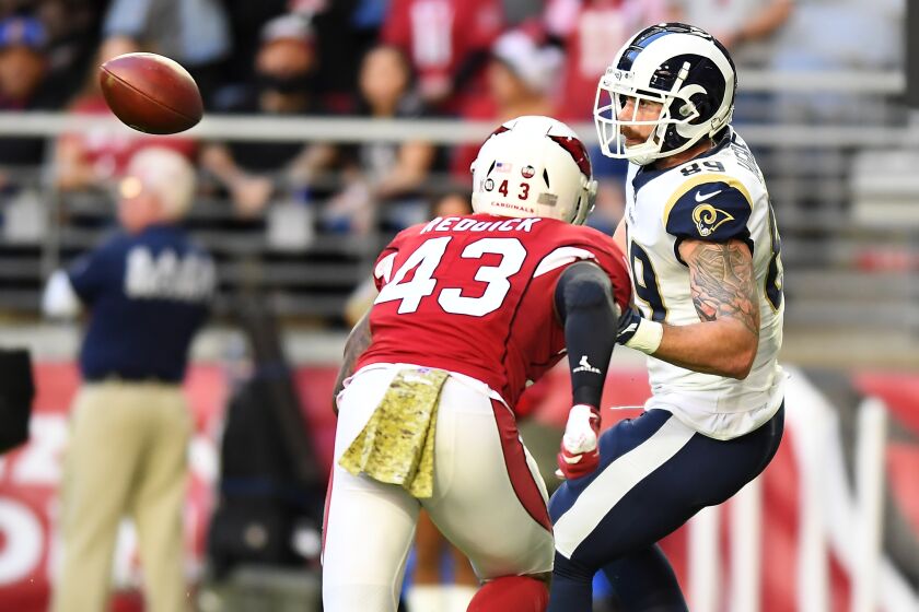 Rams tight end Tyler Higbee catches a touchdown pass in front of Cardinals linebacker Haason Reddick.