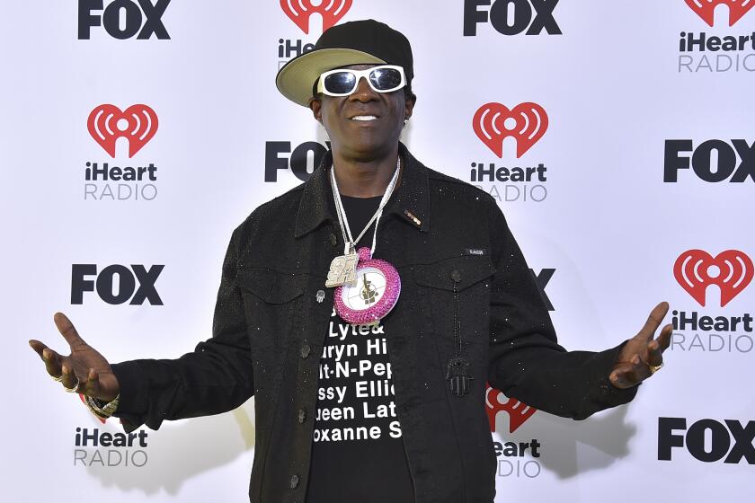 FILE - Flavor Flav arrives at the iHeartRadio Music Awards on Monday, April 1, 2024, in Los Angeles. Maggie Steffens asked for more support for the U.S. women's water polo team, and the captain received one particularly surprising response. From a clock-wearing rap icon.(Photo by Jordan Strauss/Invision/AP, File)