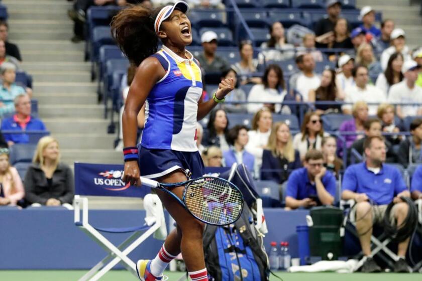 Naomi Osaka, of Japan, reacts after scoring a point against Angelique Kerber, of Germany, during the first round of the U.S. Open tennis tournament, Tuesday, Aug. 29, 2017, in New York. (AP Photo/Frank Franklin II)