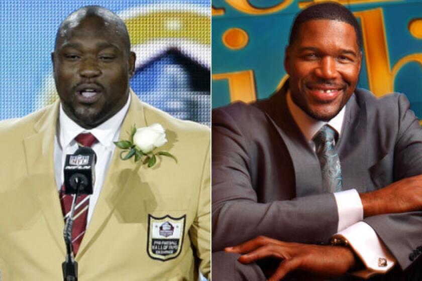 Hall of Famer Warren Sapp, left, doesn't think Michael Strahan is worthy of joining him in Canton, Ohio.