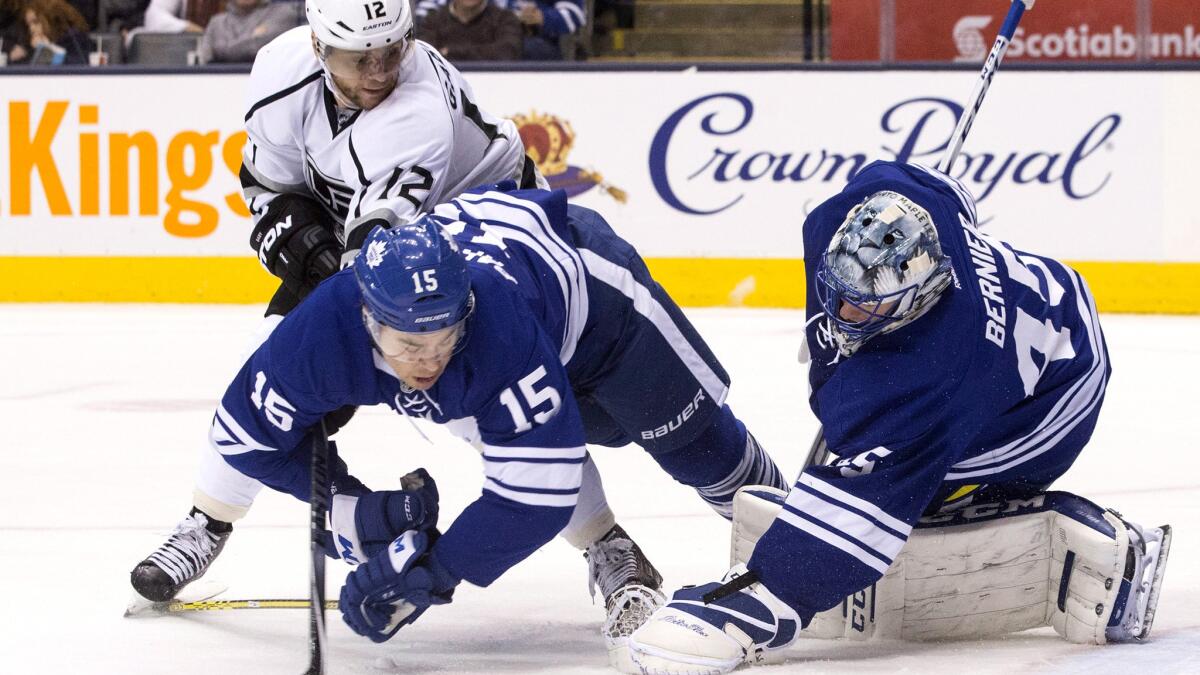 Kings right wing Marian Gaborik looks for a rebound as Maple Leafs goaltender Jonathan Bernier stops a shot and right wing Pierre-Alexandre Parenteau (15) falls to the ice Saturday.