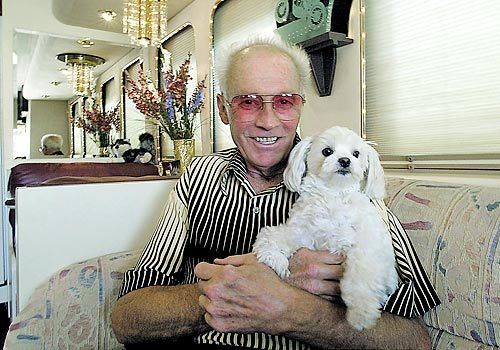Knievel was born in Butte, Mont., and spent some of his later years there. In this September 2001 photo, he's shown at his home with his dog, Rocket.